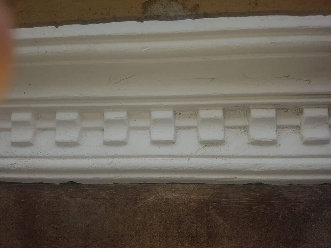 Close-up of dentil block coving profile during fitting