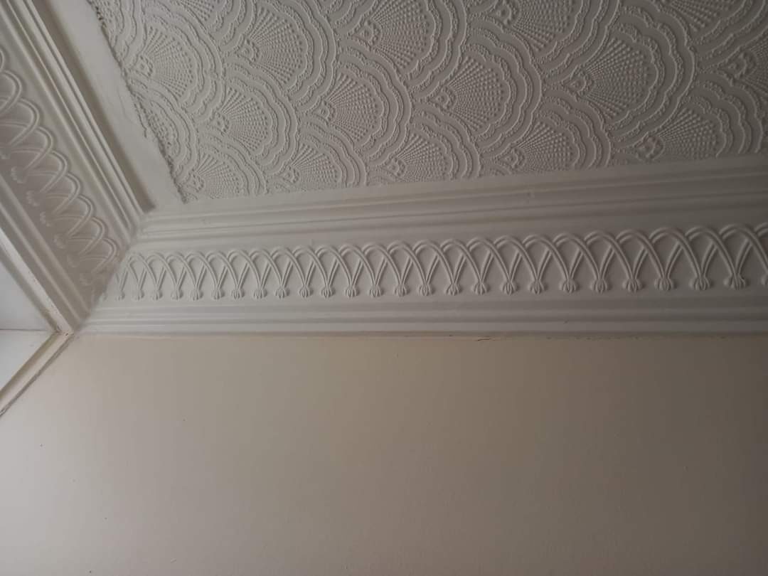Cornice corner beneath a textured ceiling