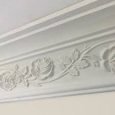 Hand-carved floral coving detail, close up