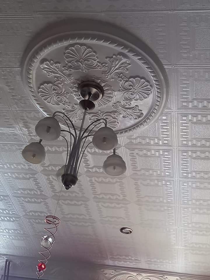 Decorative ceiling rose with chandelier fitting